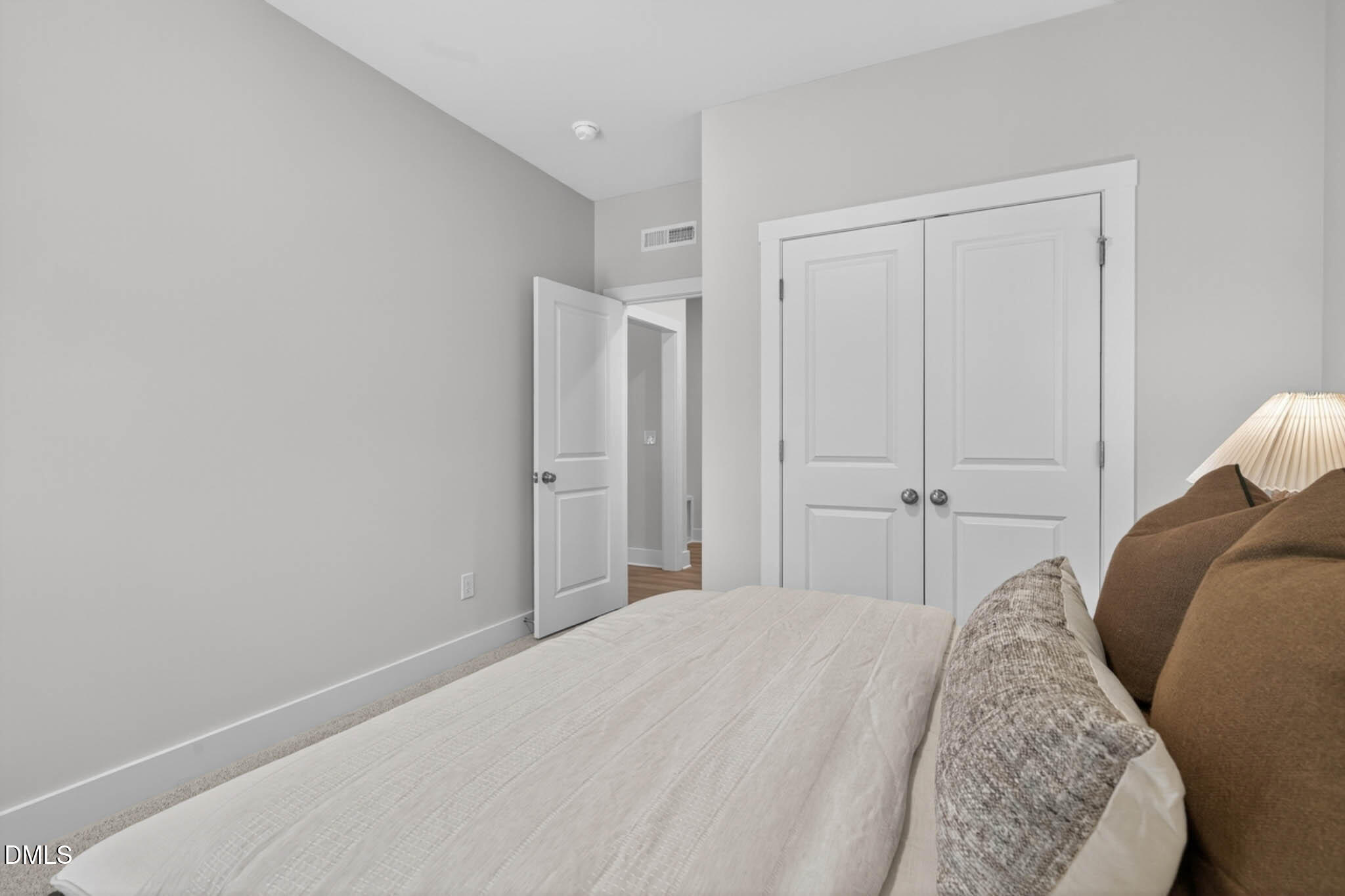 778 Beacon Hl Road Lillington, NC 27546 - Photo 22 of 44 a bedroom with a bed and a closet