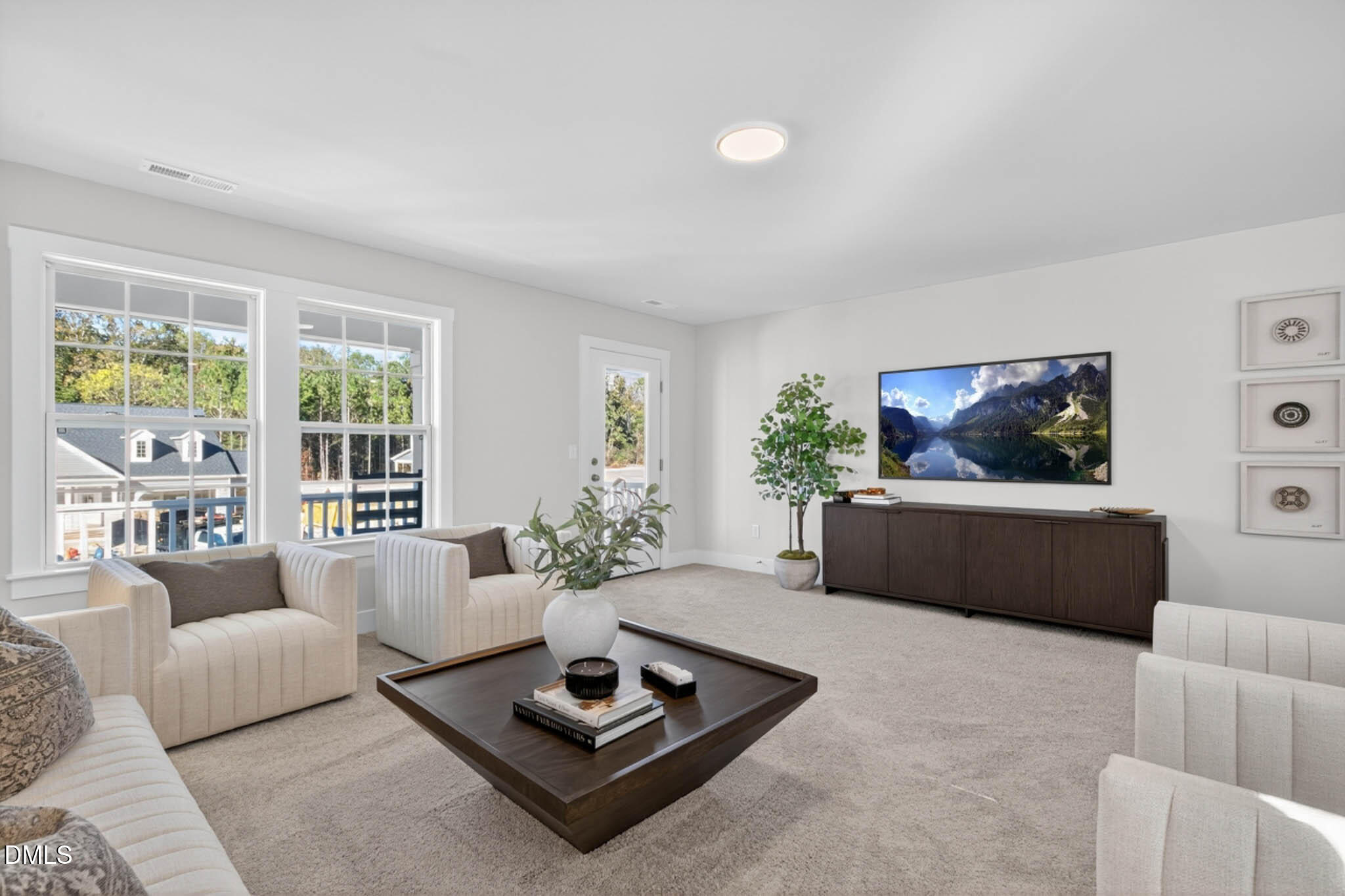 778 Beacon Hl Road Lillington, NC 27546 - Photo 24 of 44 a living room with furniture a rug and a flat screen tv