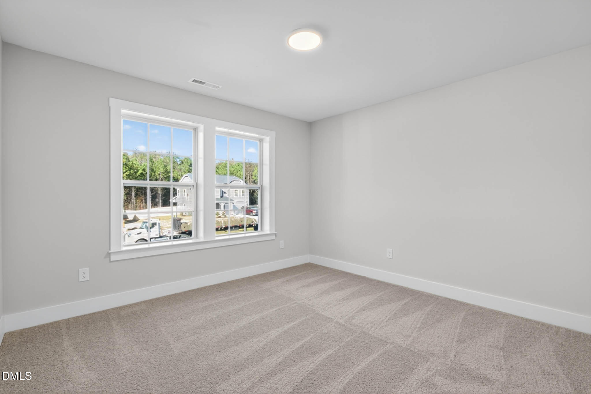 778 Beacon Hl Road Lillington, NC 27546 - Photo 34 of 44 an empty room with a window