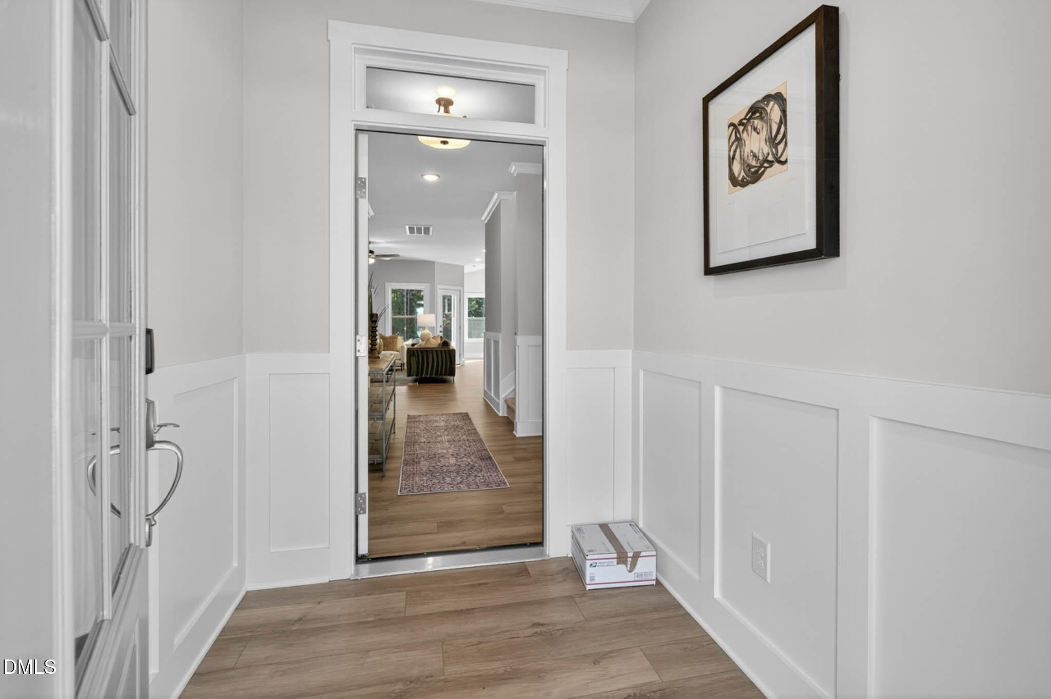 778 Beacon Hl Road Lillington, NC 27546 - Photo 5 of 44 a view of a hallway with wooden floor and a bathroom