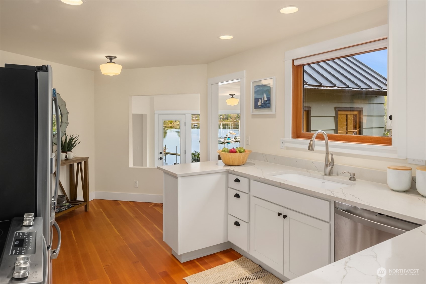 8260 Northeast Hidden Cove Road Bainbridge Island, WA 98110 - Photo 15 of 35 a spacious bathroom with a sink double vanity and a mirror