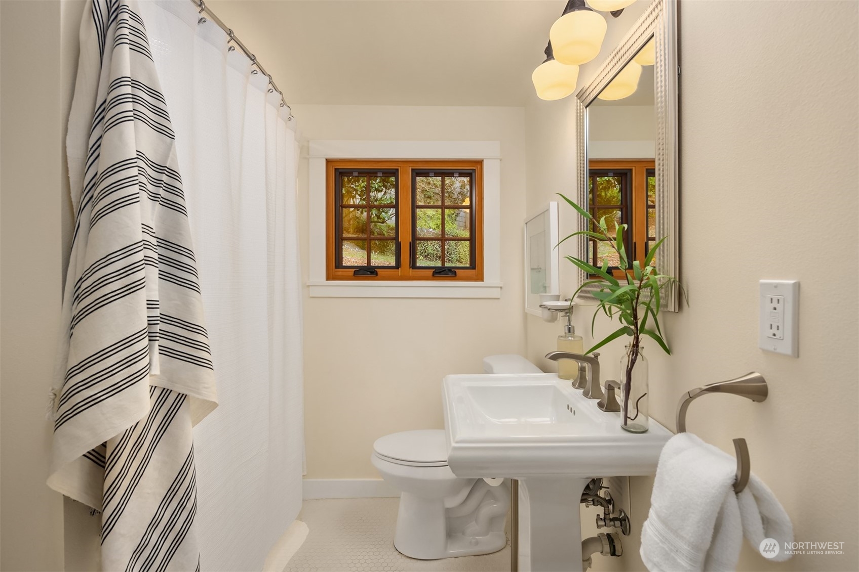 8260 Northeast Hidden Cove Road Bainbridge Island, WA 98110 - Photo 20 of 35 a bathroom with a toilet sink and mirror