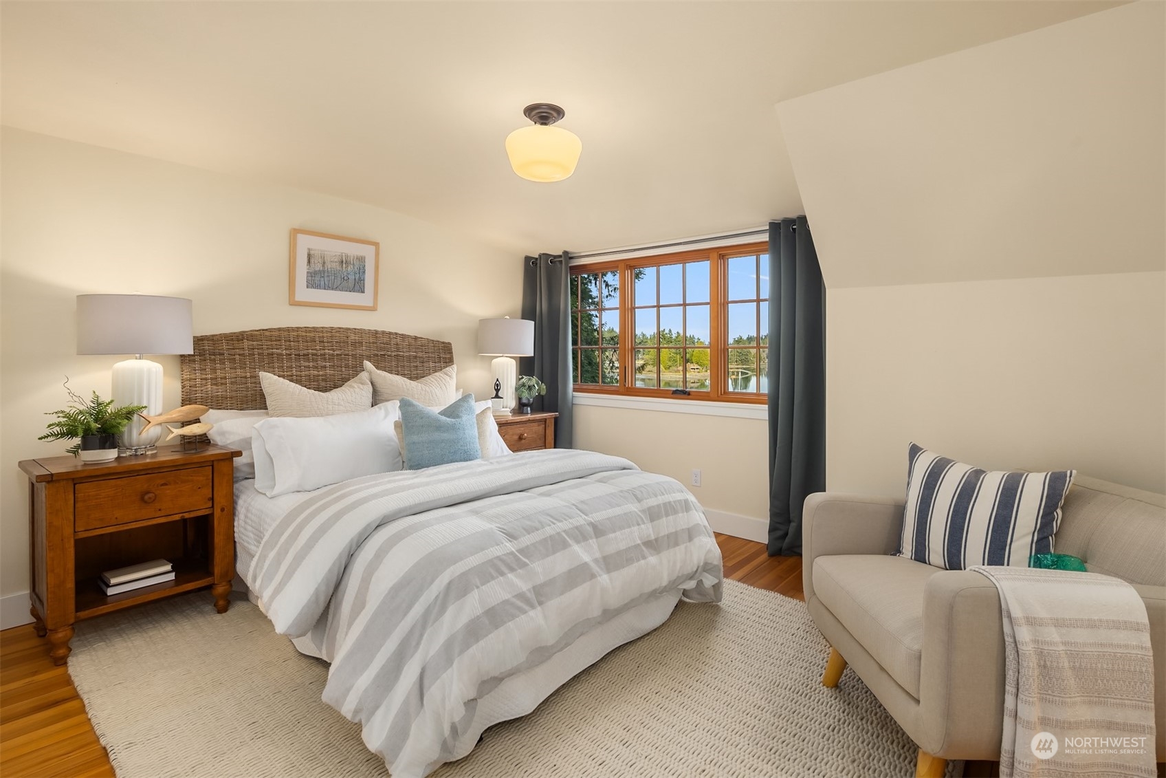 8260 Northeast Hidden Cove Road Bainbridge Island, WA 98110 - Photo 23 of 35 a bedroom with a bed and window