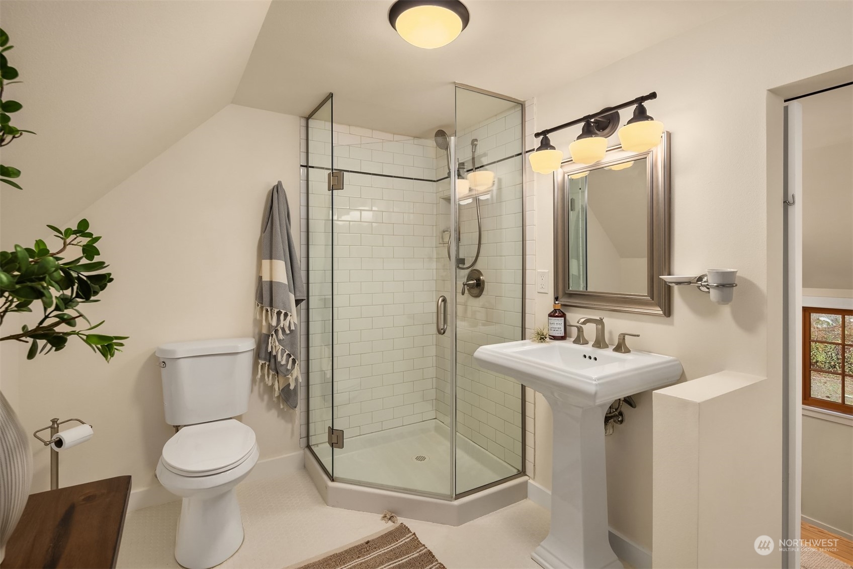 8260 Northeast Hidden Cove Road Bainbridge Island, WA 98110 - Photo 25 of 35 a bathroom with a toilet sink and shower