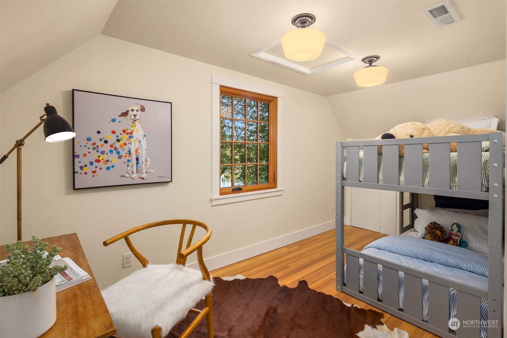 8260 Northeast Hidden Cove Road Bainbridge Island, WA 98110 - Photo 26 of 35 a bedroom with furniture and a window