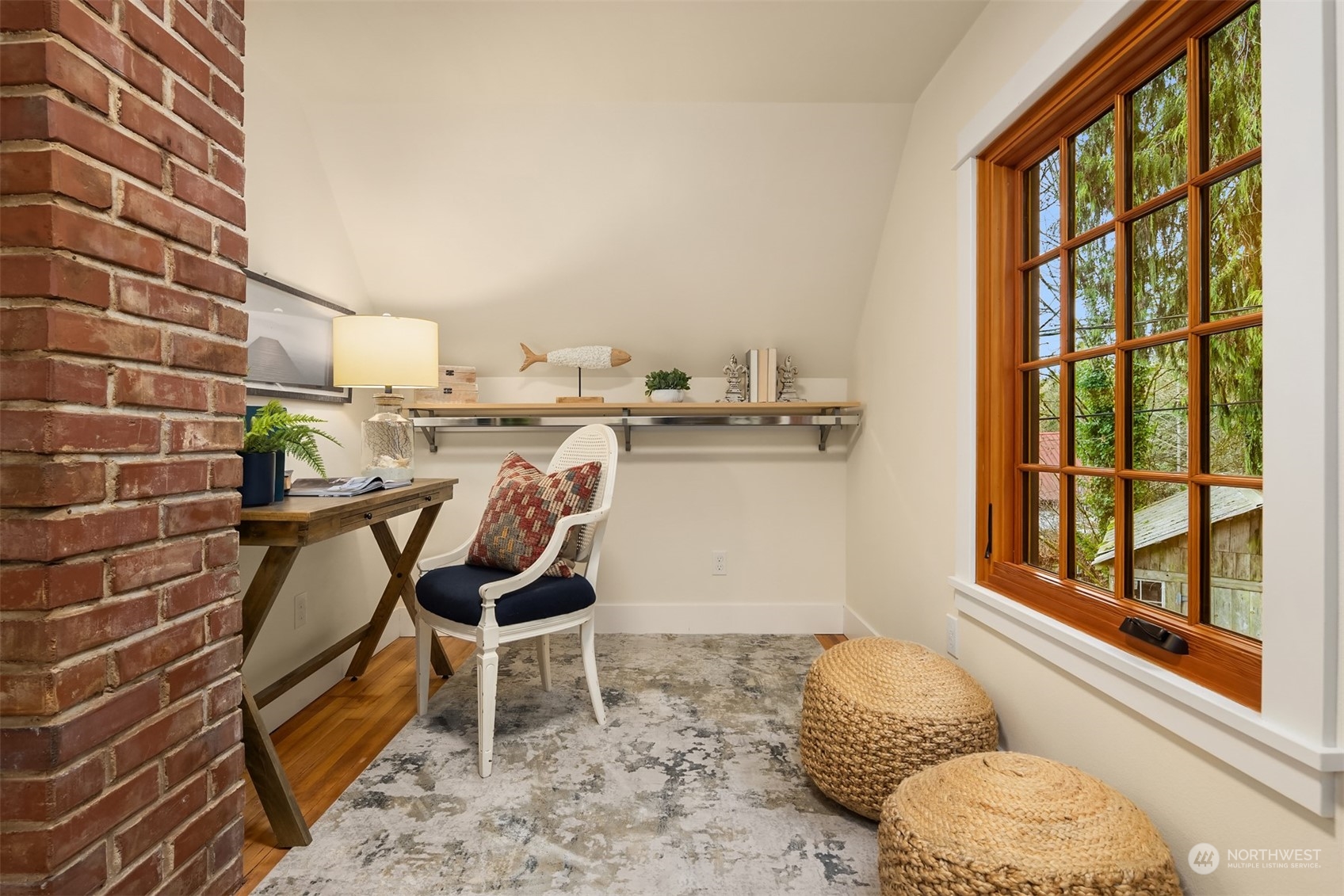 8260 Northeast Hidden Cove Road Bainbridge Island, WA 98110 - Photo 27 of 35 a living room with furniture and a floor to ceiling window