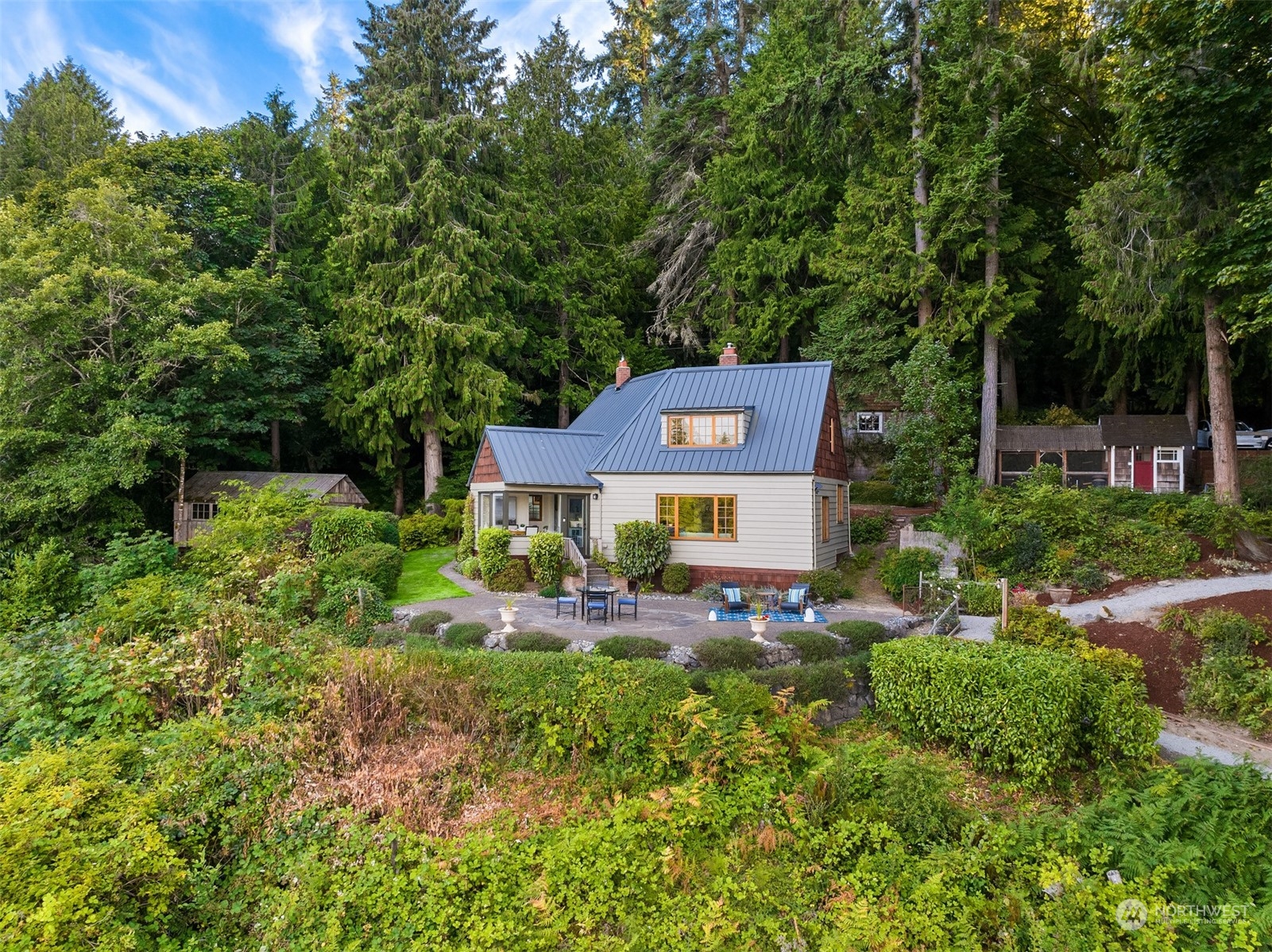 8260 Northeast Hidden Cove Road Bainbridge Island, WA 98110 - Photo 28 of 35 a backyard of a house with yard and outdoor seating