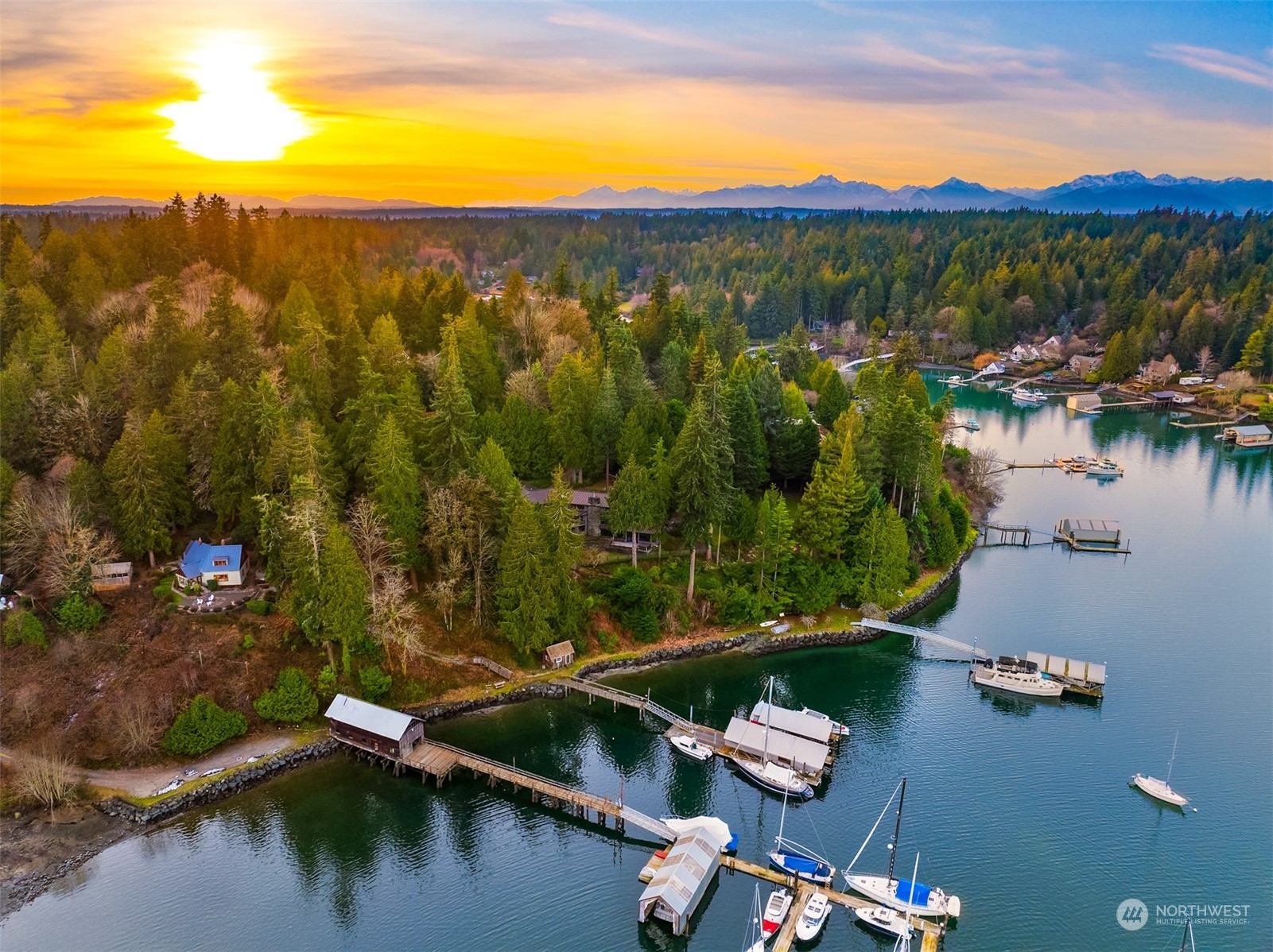 8260 Northeast Hidden Cove Road Bainbridge Island, WA 98110 - Photo 29 of 35 a view of a lake with a yard