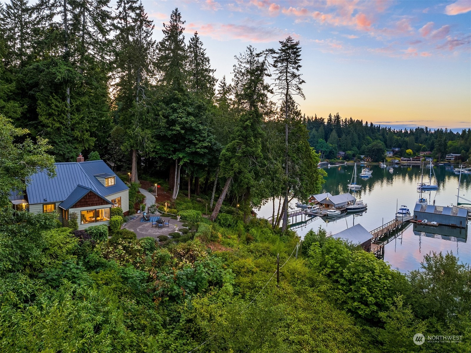8260 Northeast Hidden Cove Road Bainbridge Island, WA 98110 - Photo 3 of 35 a view of a house with pool and sitting area