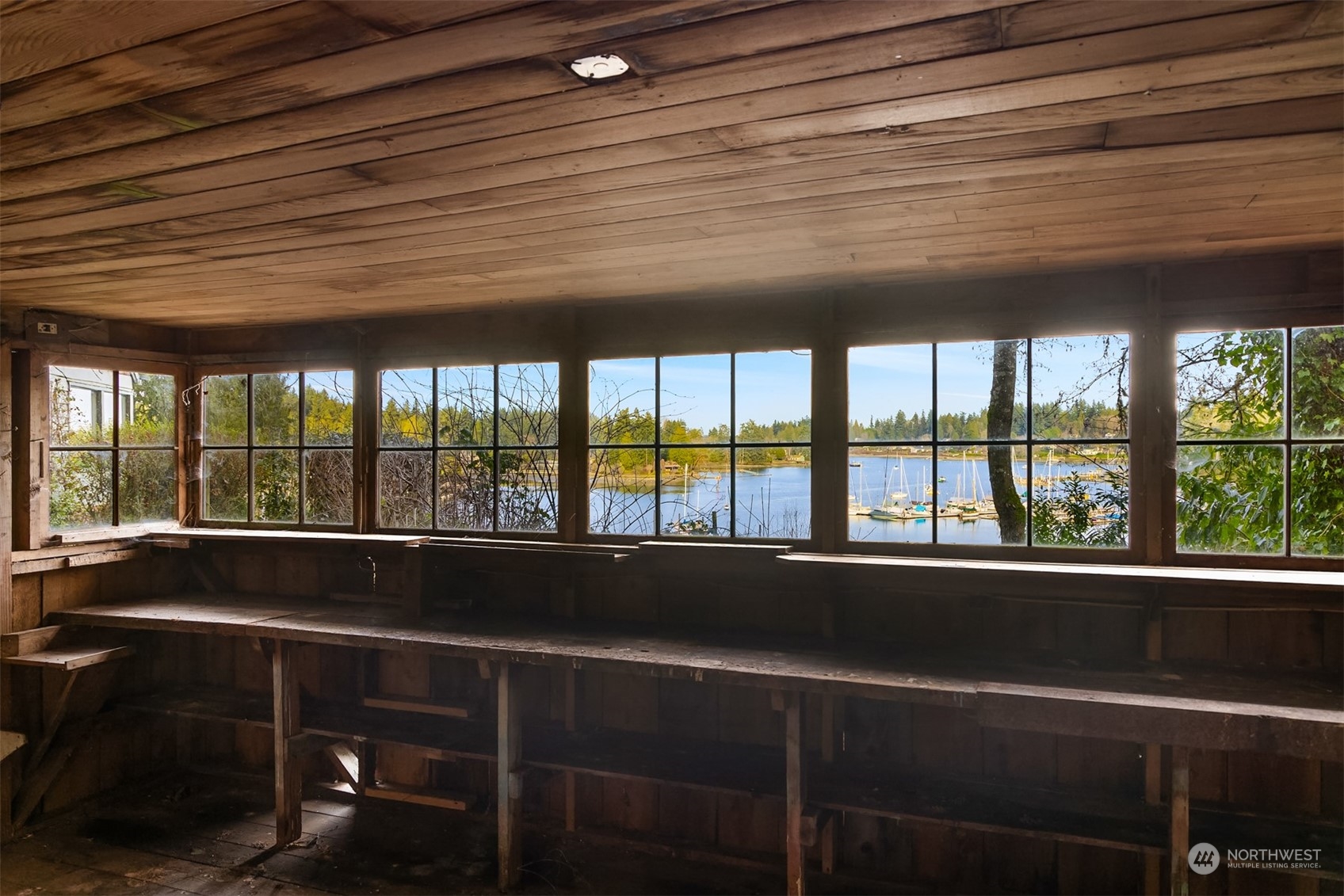 8260 Northeast Hidden Cove Road Bainbridge Island, WA 98110 - Photo 31 of 35 a view of a room with a large window and pool table