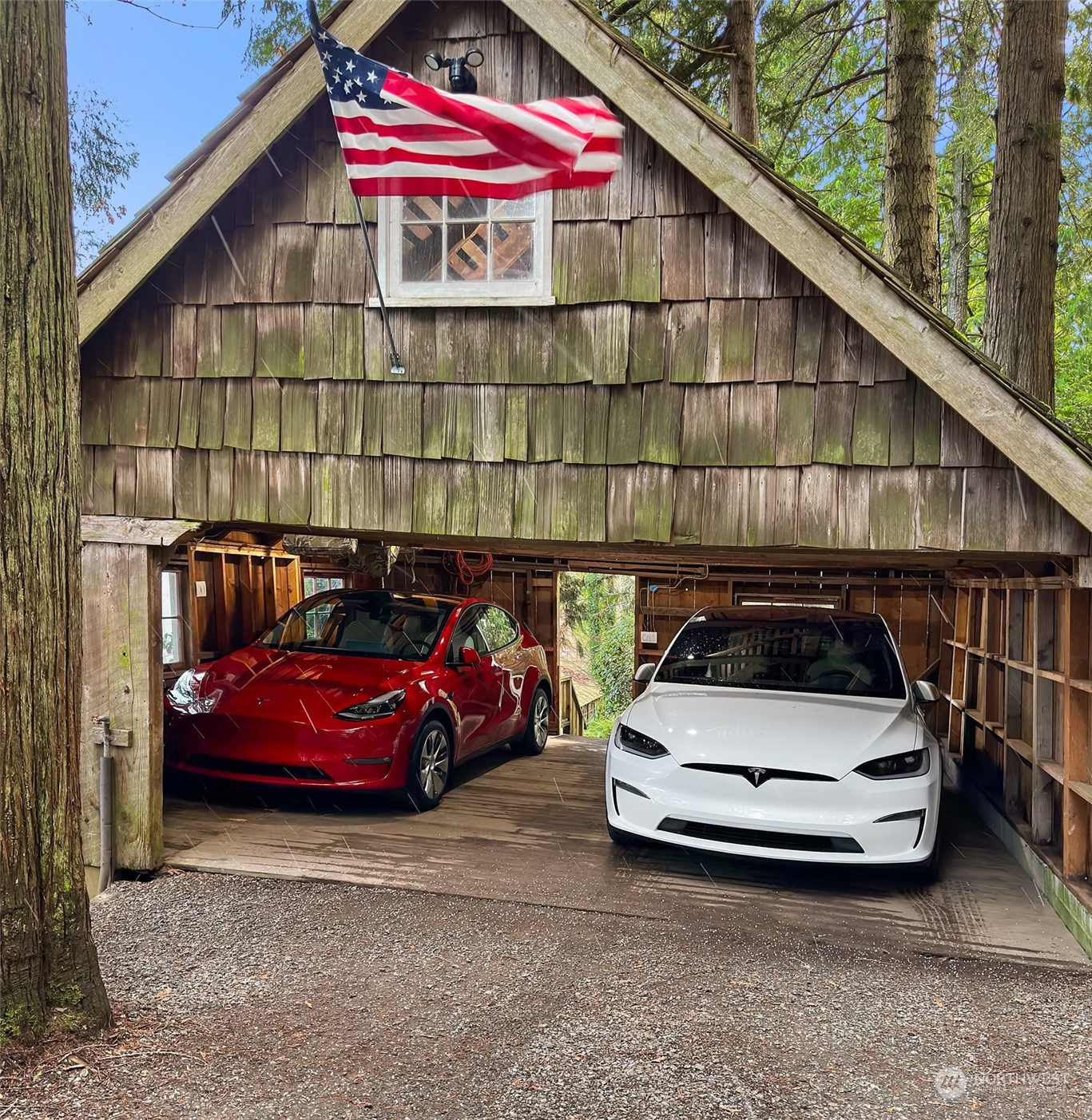 8260 Northeast Hidden Cove Road Bainbridge Island, WA 98110 - Photo 33 of 35 a car parked in front of a house