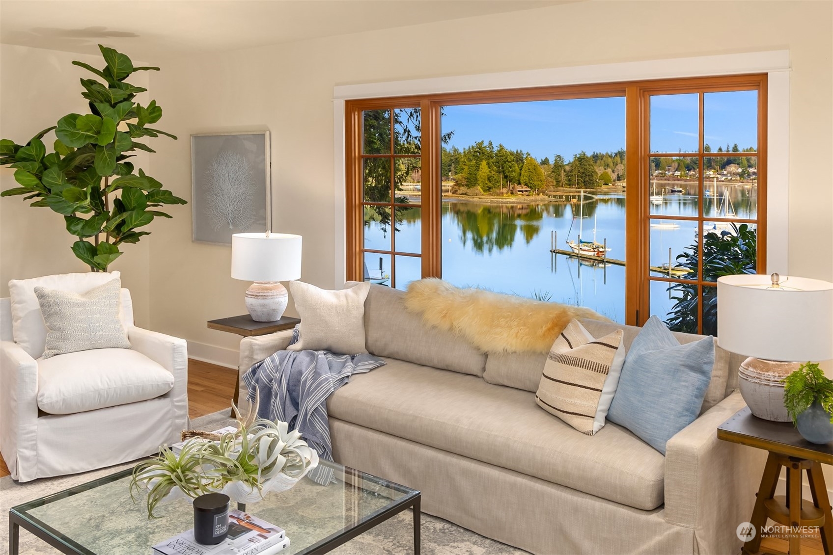 8260 Northeast Hidden Cove Road Bainbridge Island, WA 98110 - Photo 6 of 35 a living room with furniture and a large window