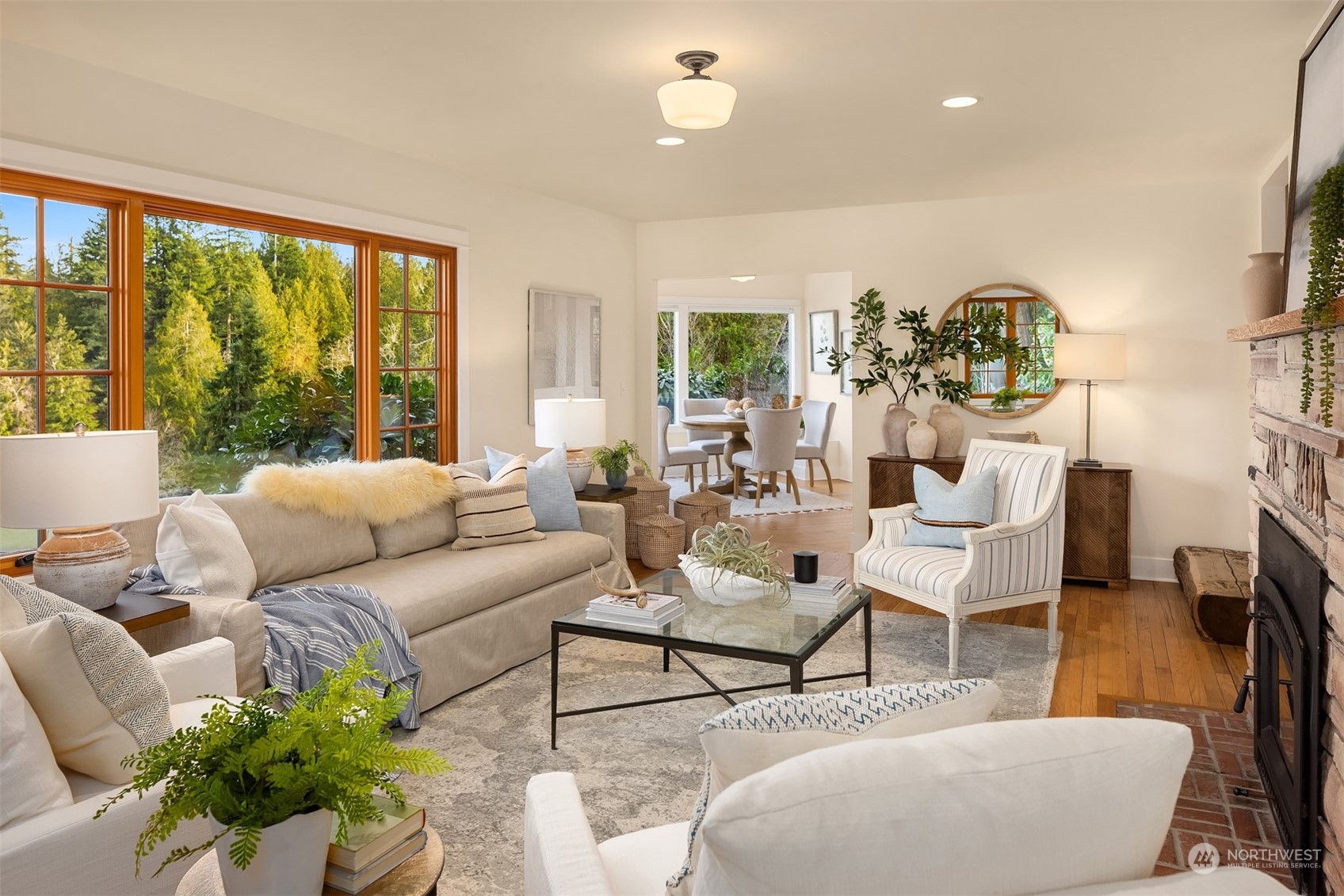 8260 Northeast Hidden Cove Road Bainbridge Island, WA 98110 - Photo 8 of 35 a living room with furniture and a large window