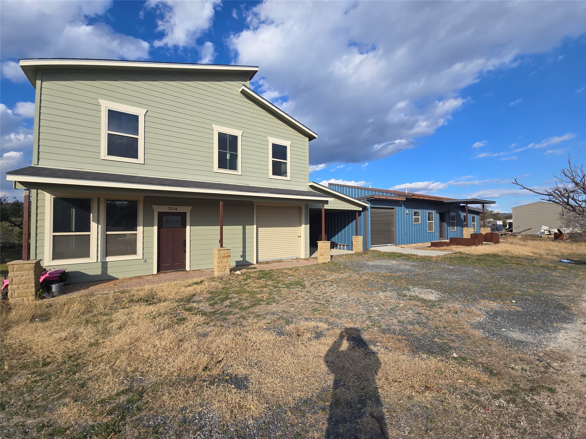304 Spring Street Burnet, TX 78611 - Photo 2 of 11 Rear view of house featuring a garage