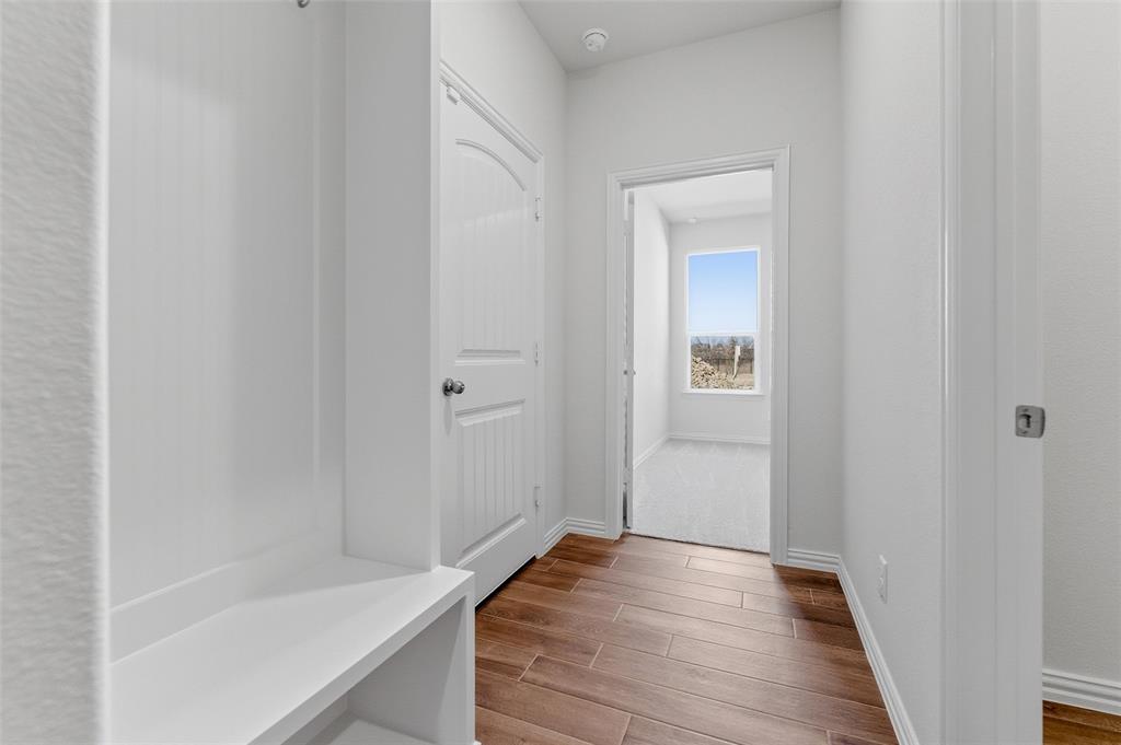 14408 Shooting Star Drive Haslet, TX 76052 - Photo 11 of 25 a view of a hallway with wooden floor