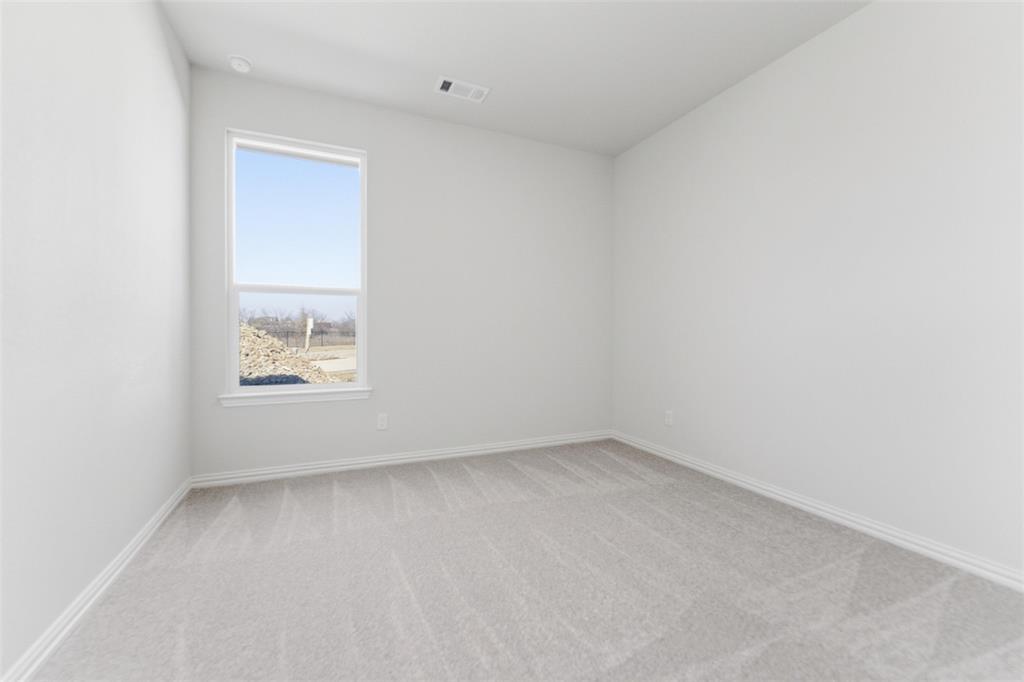 14408 Shooting Star Drive Haslet, TX 76052 - Photo 13 of 25 an empty room with a window