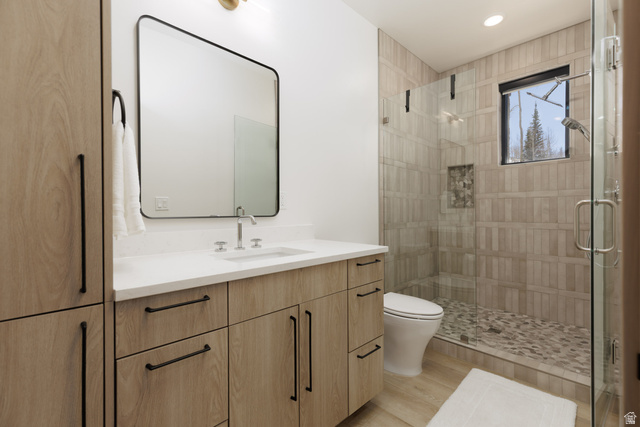 160 Ridgeview Street, Unit 7B Brian Head, UT 84719 - Photo 17 of 40 En-suite bathroom with vanity, a shower stall, light wood-style floors, and recessed lighting