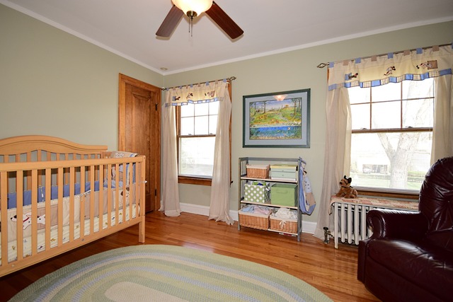538 Byrd Road Riverside, IL 60546 - Photo 19 of 24 a view of a bedroom with furniture window and wooden floor