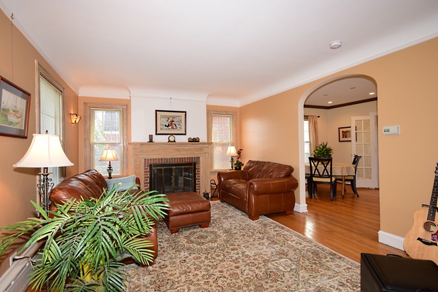 538 Byrd Road Riverside, IL 60546 - Photo 3 of 24 a living room with furniture fireplace and a table