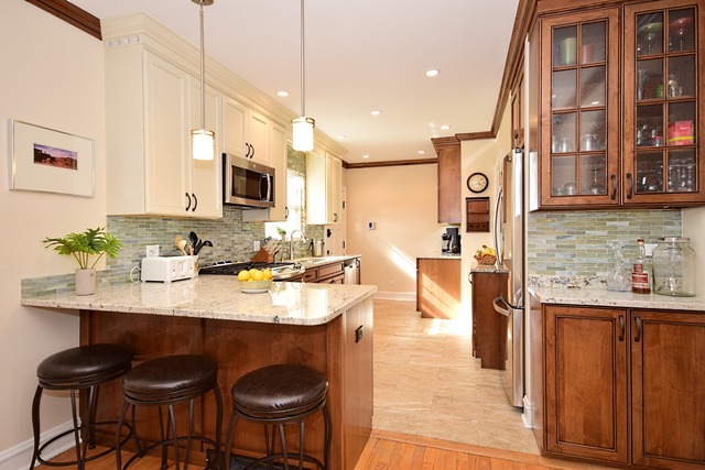 538 Byrd Road Riverside, IL 60546 - Photo 9 of 24 a kitchen with stainless steel appliances granite countertop a sink a stove and a refrigerator