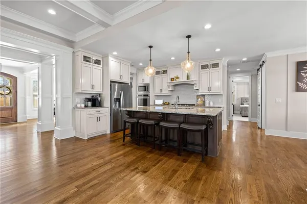 a bedroom with a large bed and a window
