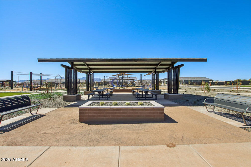 15718 West Corte Del Sol Este Waddell, AZ 85355 - Photo 11 of 14 a view of a patio with swimming pool table and chairs