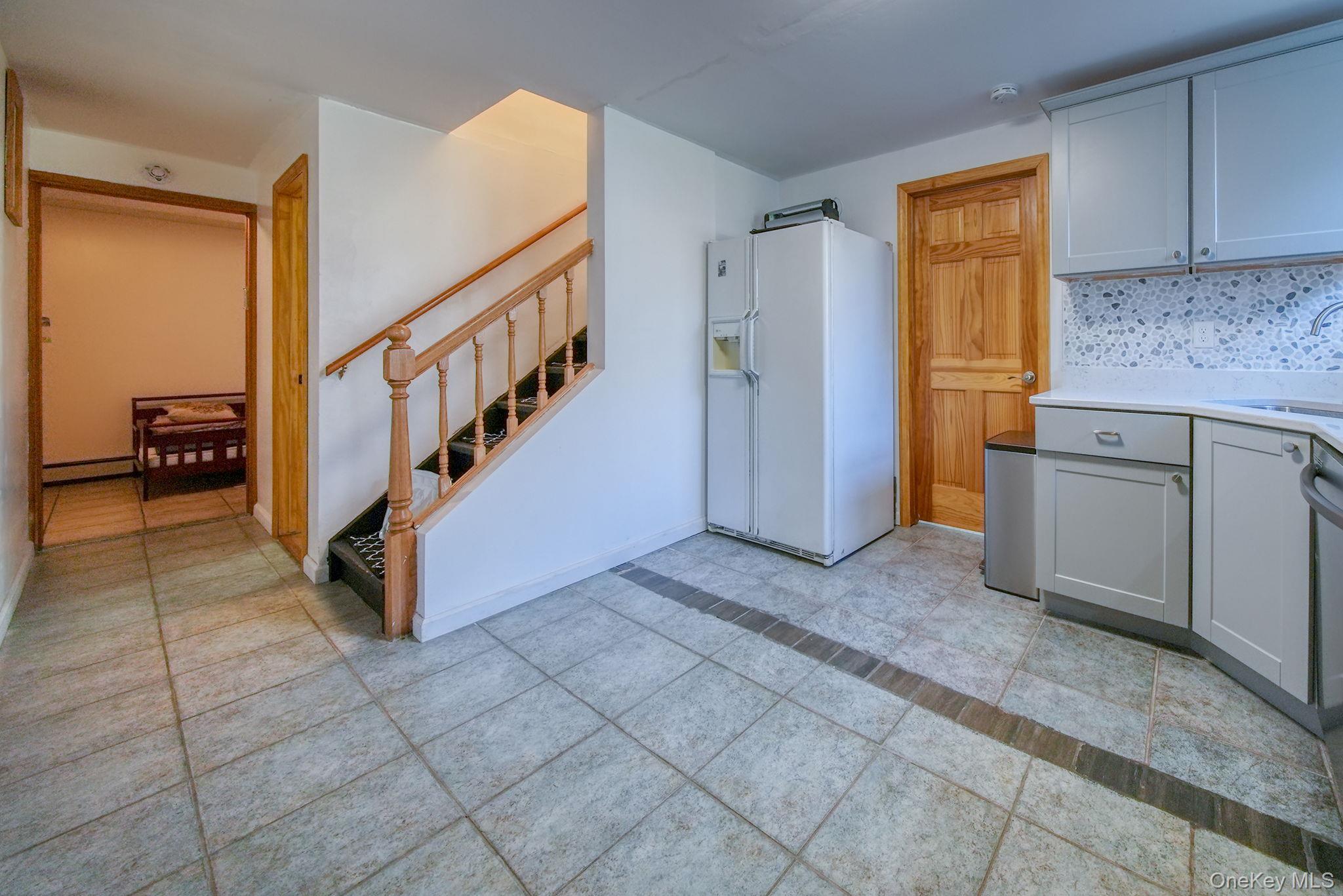 158 Wade Road Liberty, NY 12754 - Photo 21 of 40 a view of entryway with cabinets and stairs