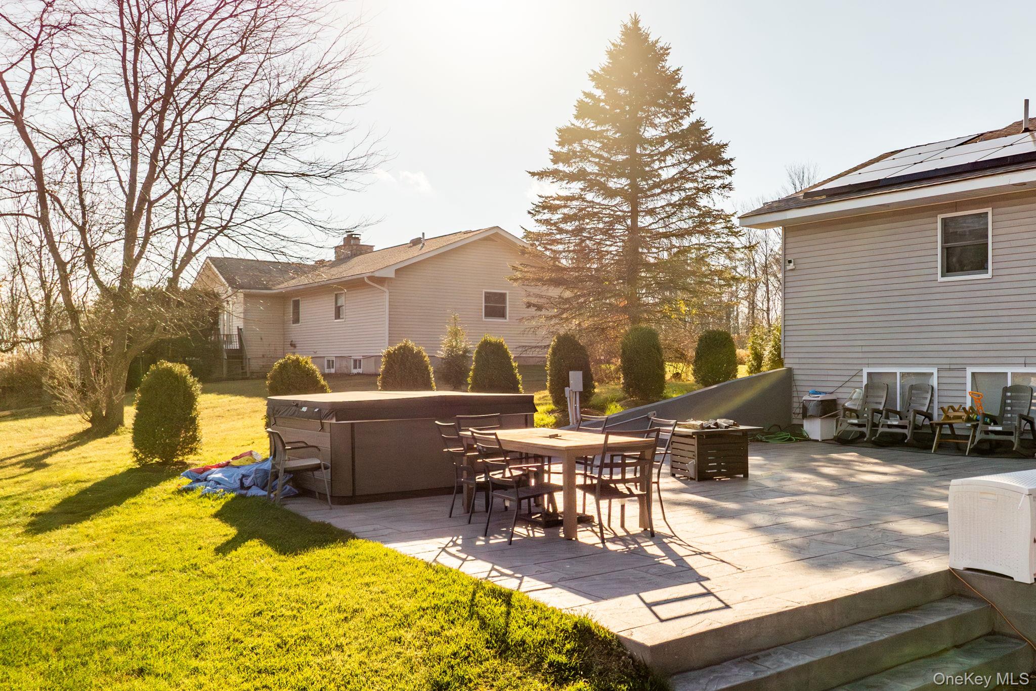 158 Wade Road Liberty, NY 12754 - Photo 33 of 40 a view of a patio with table and chairs with wooden floor and fence