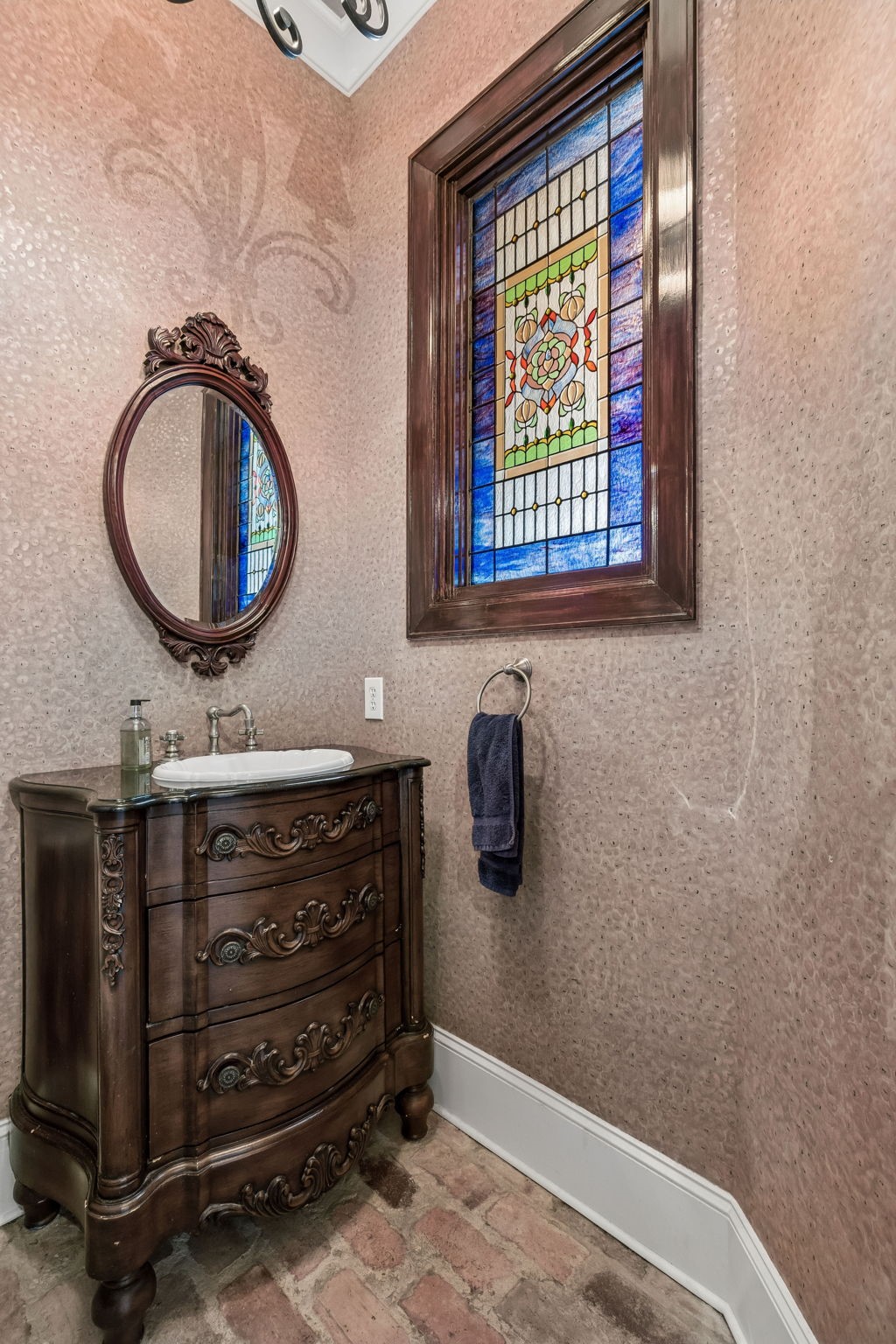 27306 Owosso Court Spring, TX 77386 - Photo 18 of 36 a bathroom with a sink a mirror and a window