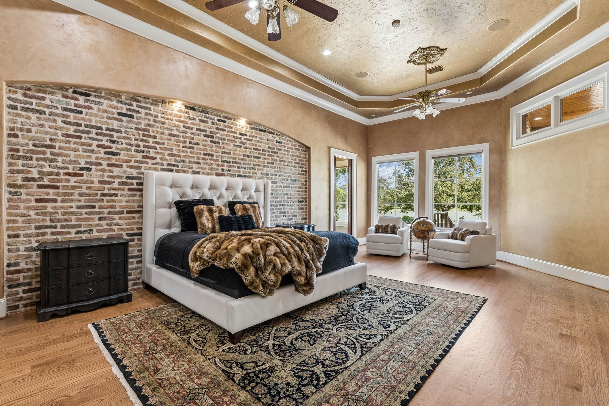 27306 Owosso Court Spring, TX 77386 - Photo 22 of 36 a bedroom with a bed couch and a fireplace