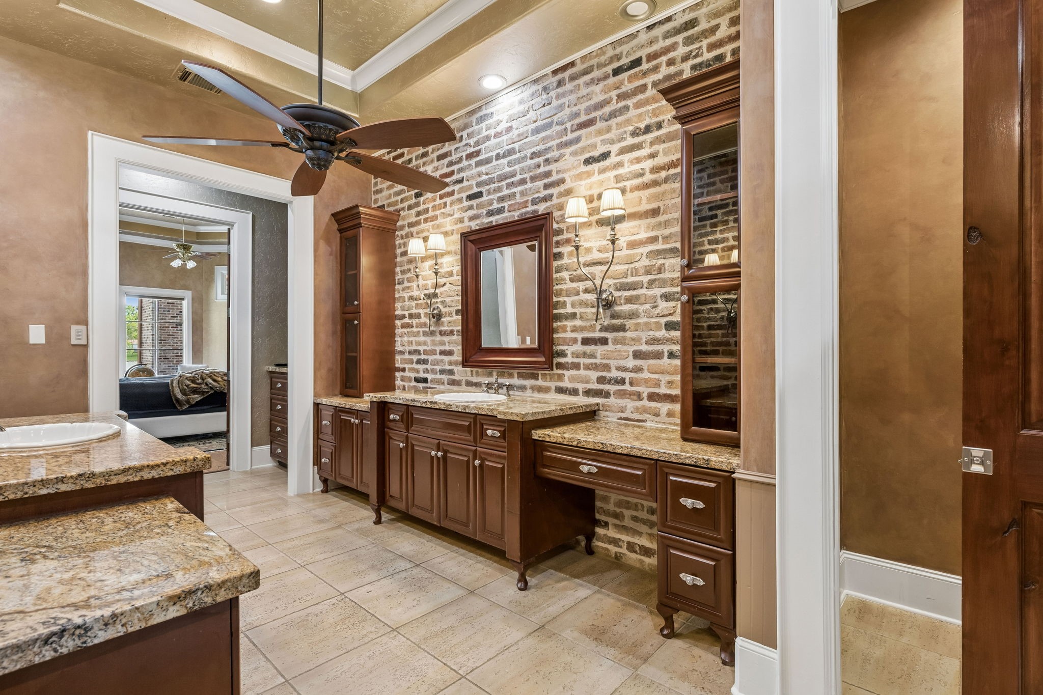 27306 Owosso Court Spring, TX 77386 - Photo 23 of 36 a large kitchen with kitchen island granite countertop a sink and a stove top oven