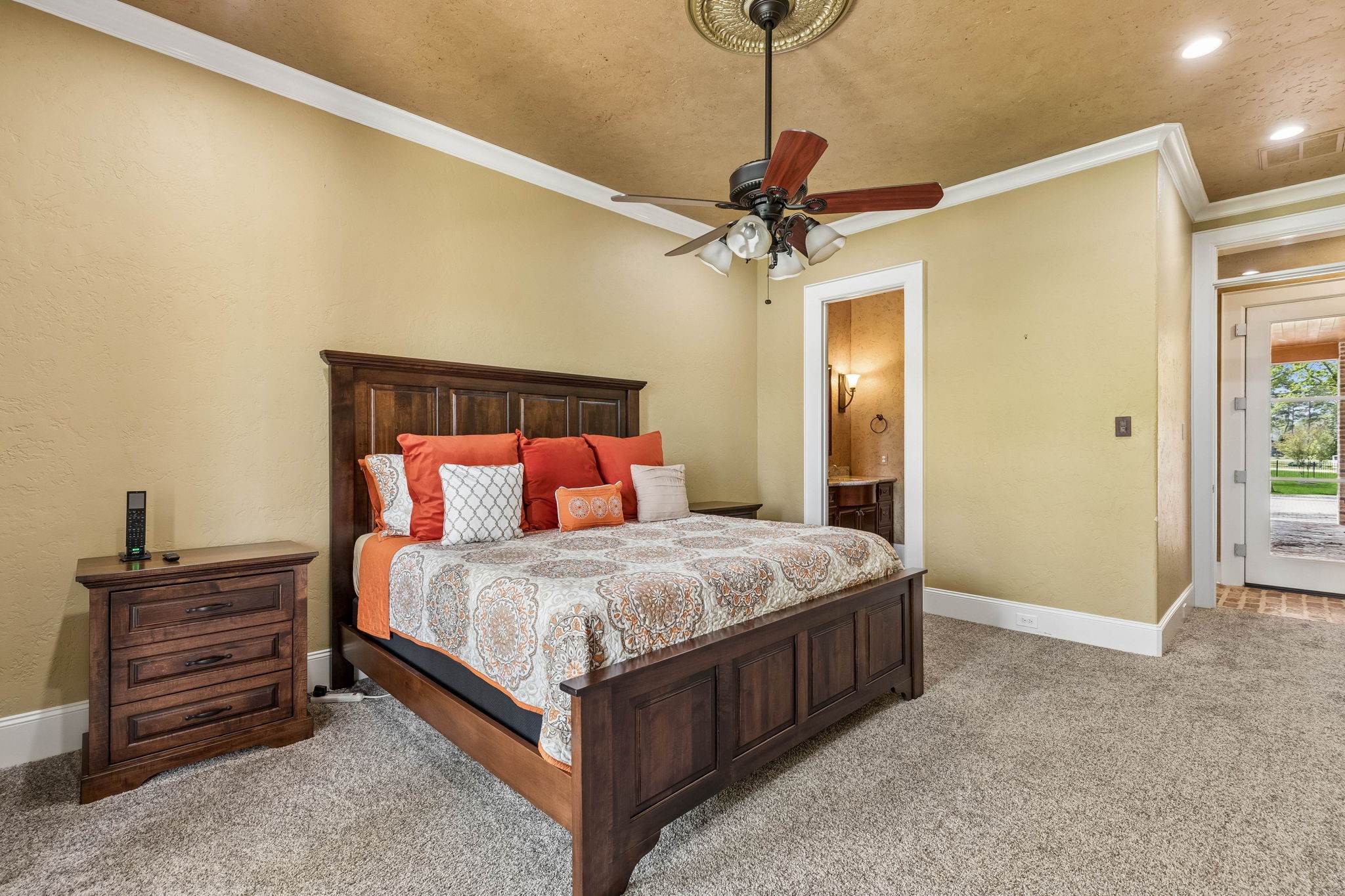 27306 Owosso Court Spring, TX 77386 - Photo 27 of 36 a bedroom with a bed and a chandelier