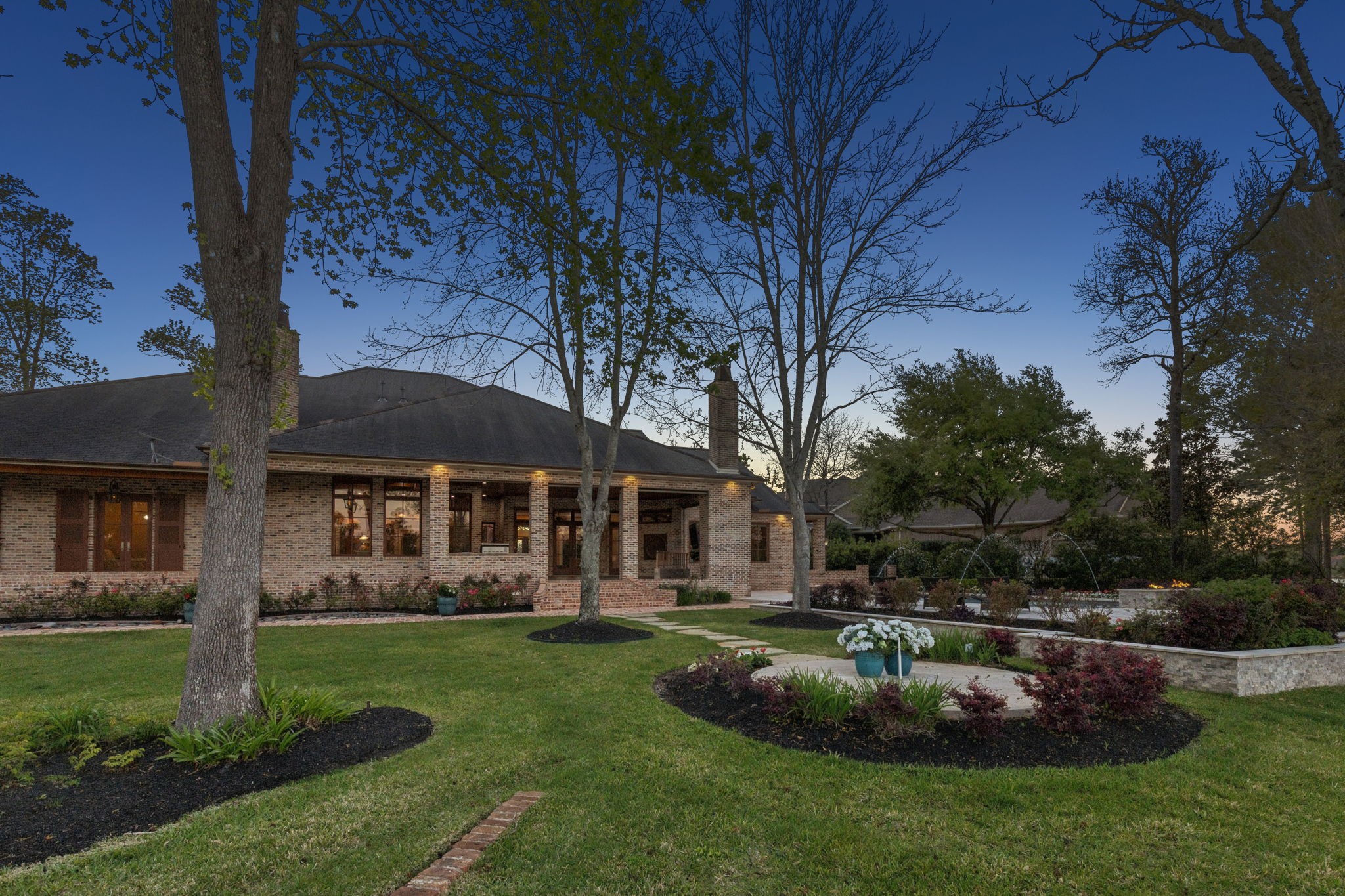 27306 Owosso Court Spring, TX 77386 - Photo 32 of 36 a front view of a house with a garden