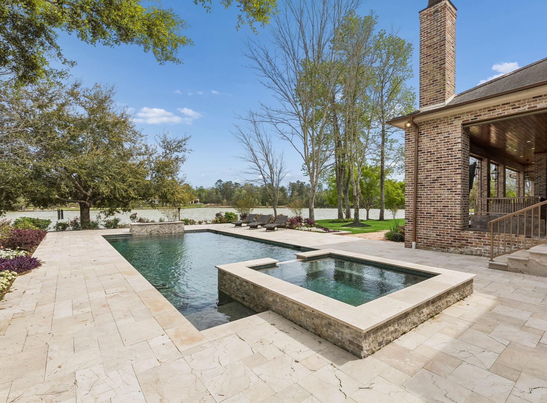 27306 Owosso Court Spring, TX 77386 - Photo 6 of 36 a view of a swimming pool with a patio