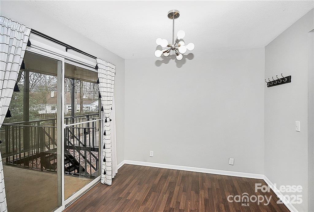 2634 Park Road, Unit D Charlotte, NC 28209 - Photo 19 of 30 a view of a room with wooden floor