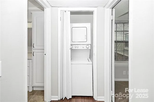 a view of bathroom with a door and a white door