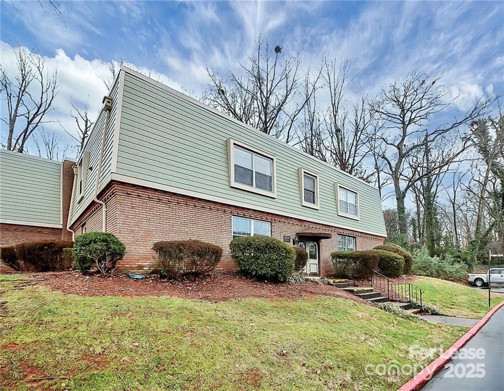 2634 Park Road, Unit D Charlotte, NC 28209 - Photo 2 of 30 a front view of a house with garden