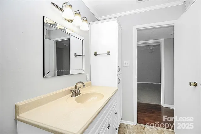 a bathroom with a sink a mirror and a shower