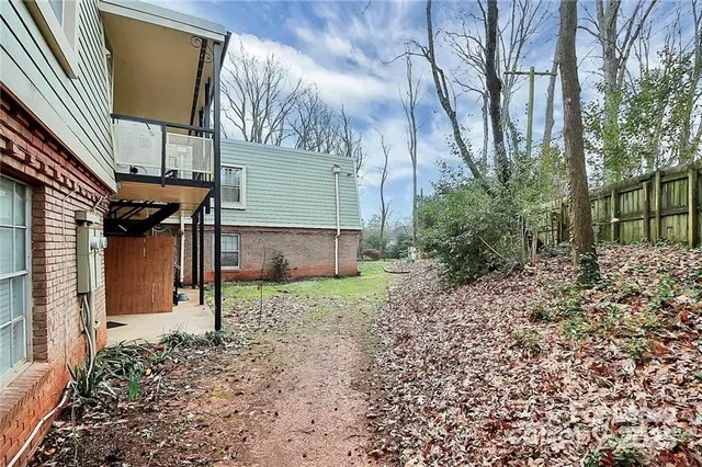 a backyard of a house with lots of green space