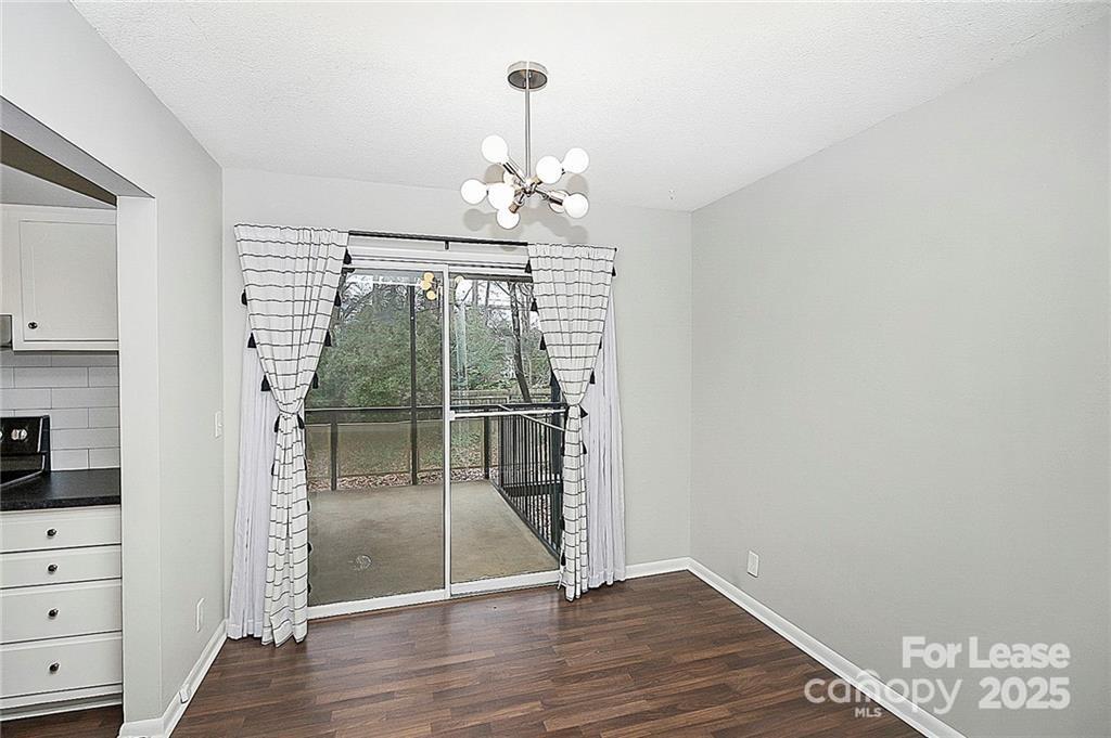 2634 Park Road, Unit D Charlotte, NC 28209 - Photo 10 of 30 a view of a hallway with wooden floor and staircase