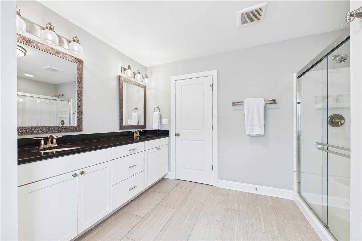 811 Michigan Street Wheaton, IL 60187 - Photo 16 of 33 a bathroom with a double vanity sink and mirror