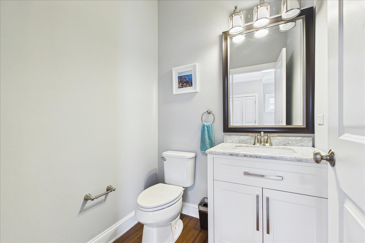 811 Michigan Street Wheaton, IL 60187 - Photo 5 of 33 a bathroom with a sink a toilet and mirror