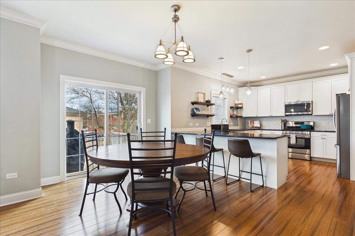 811 Michigan Street Wheaton, IL 60187 - Photo 9 of 33 a view of a dining room with furniture window and wooden floor