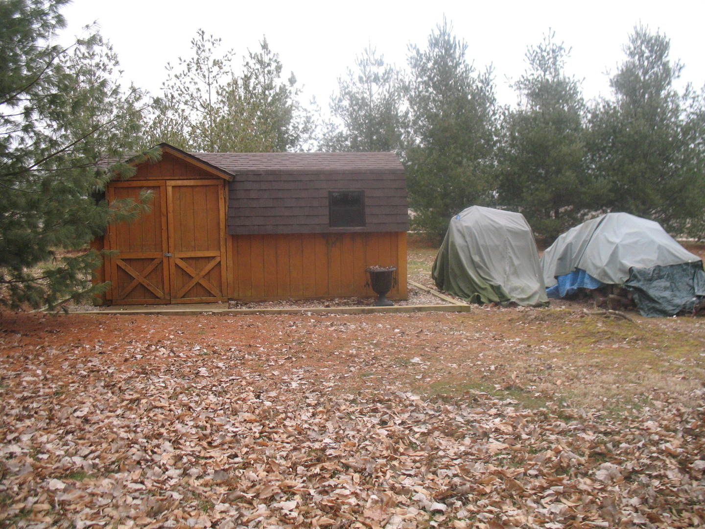 4788 Seven Hills Road Clinton, IL 61727 - Photo 11 of 46 a backyard of house with a table and chair