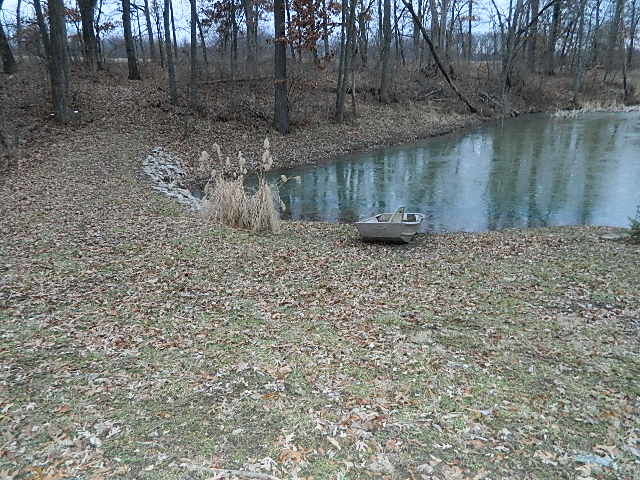 4788 Seven Hills Road Clinton, IL 61727 - Photo 18 of 46 a backyard of a house with lots of green space