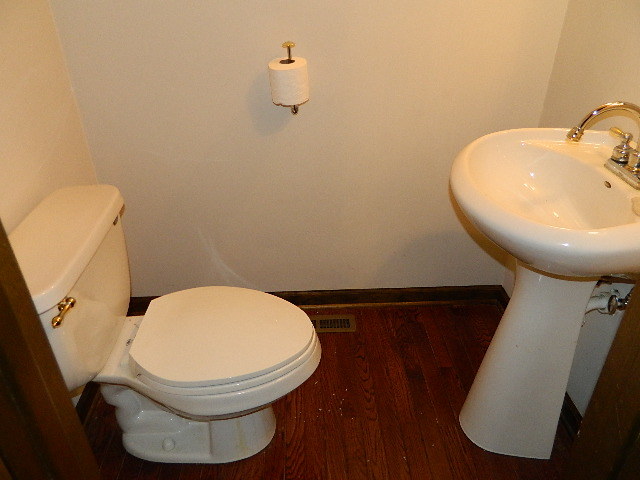 4788 Seven Hills Road Clinton, IL 61727 - Photo 30 of 46 a bathroom with a toilet and a sink