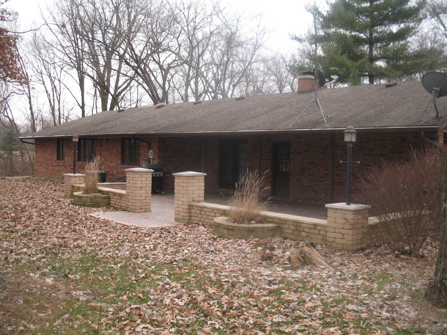4788 Seven Hills Road Clinton, IL 61727 - Photo 4 of 46 a white house that has a tree in front of it
