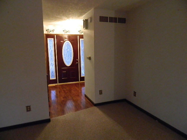 4788 Seven Hills Road Clinton, IL 61727 - Photo 34 of 46 a view of a room with wooden floor and white wall