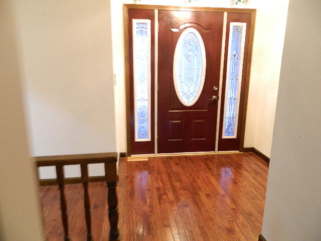 4788 Seven Hills Road Clinton, IL 61727 - Photo 35 of 46 a view of a hallway with wooden floor
