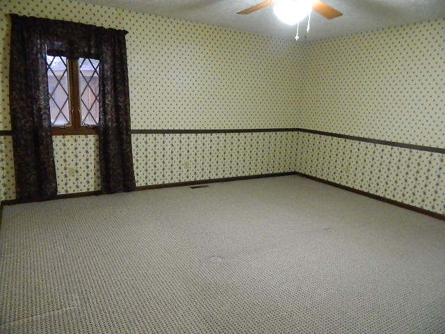 4788 Seven Hills Road Clinton, IL 61727 - Photo 39 of 46 a view of an empty room with a window